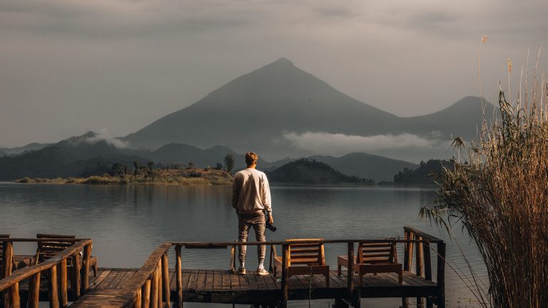 Mgahinga Gorilla National Park: Complete Guide to Gorillas, Golden Monkeys and Volcanoes Mount Muhabura rising above Lake Mutanda near Mgahinga Gorilla National Park