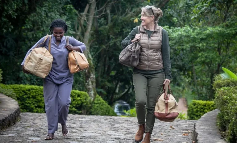 3 Day Gorilla Trekking Uganda: By Road, by Air or from Kigali Local porters carrying trekkers' bags on a gorilla trek in Uganda