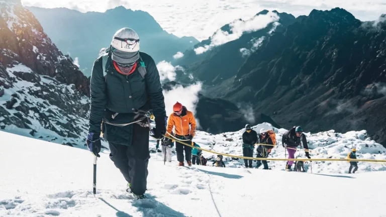 Rwenzori Mountains National Park: Complete Guide to Hiking the Mountains of the Moon Roped climbers on the glacier below Margherita Peak in Rwenzori Mountains National Park