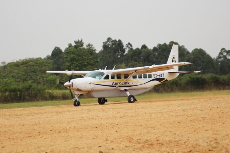 Uganda Fly-In Safari: Fly to the Gorillas and Parks in an Hour AeroLink Cessna Caravan landing on a murram airstrip in Uganda