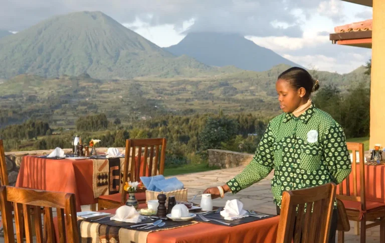 Tipping in Uganda: How Much to Tip on Your Safari Tipping in Uganda for lodge staff serving breakfast near the Virunga volcanoes
