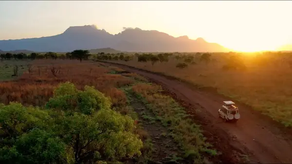 Safari vehicle at sunset in Pian Upe Wildlife Reserve, Uganda