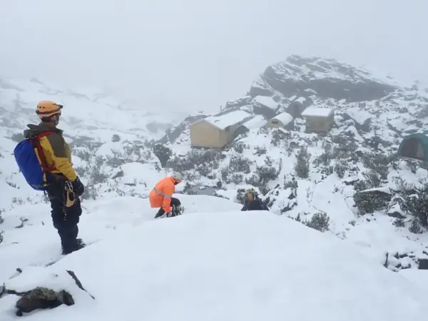 Trekkers in the snow on the Rwenzori Mountains in Uganda
