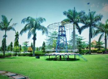 Kavumba Recreation Center Wakiso: palm-lined lawns and the children's swing ride